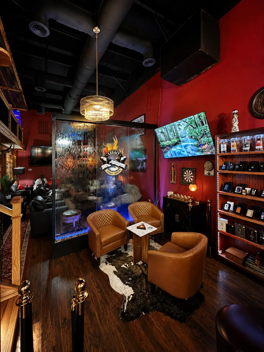 Illuminated water wall with leather club chairs