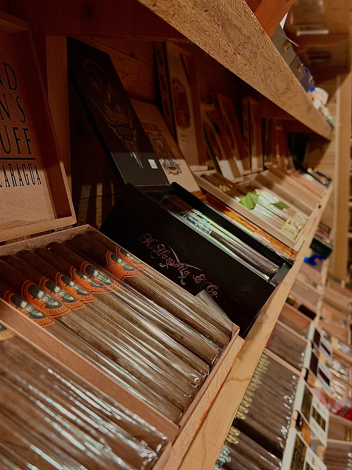 Shelves of premium cigar boxes in the humidor