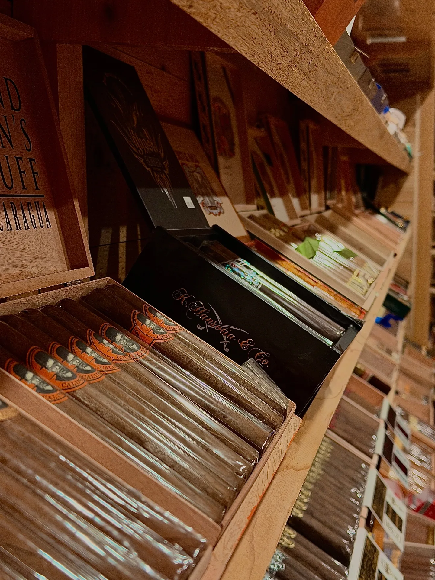 Shelves of premium cigar boxes in the humidor